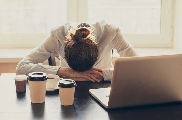 Tired businesswoman in the office